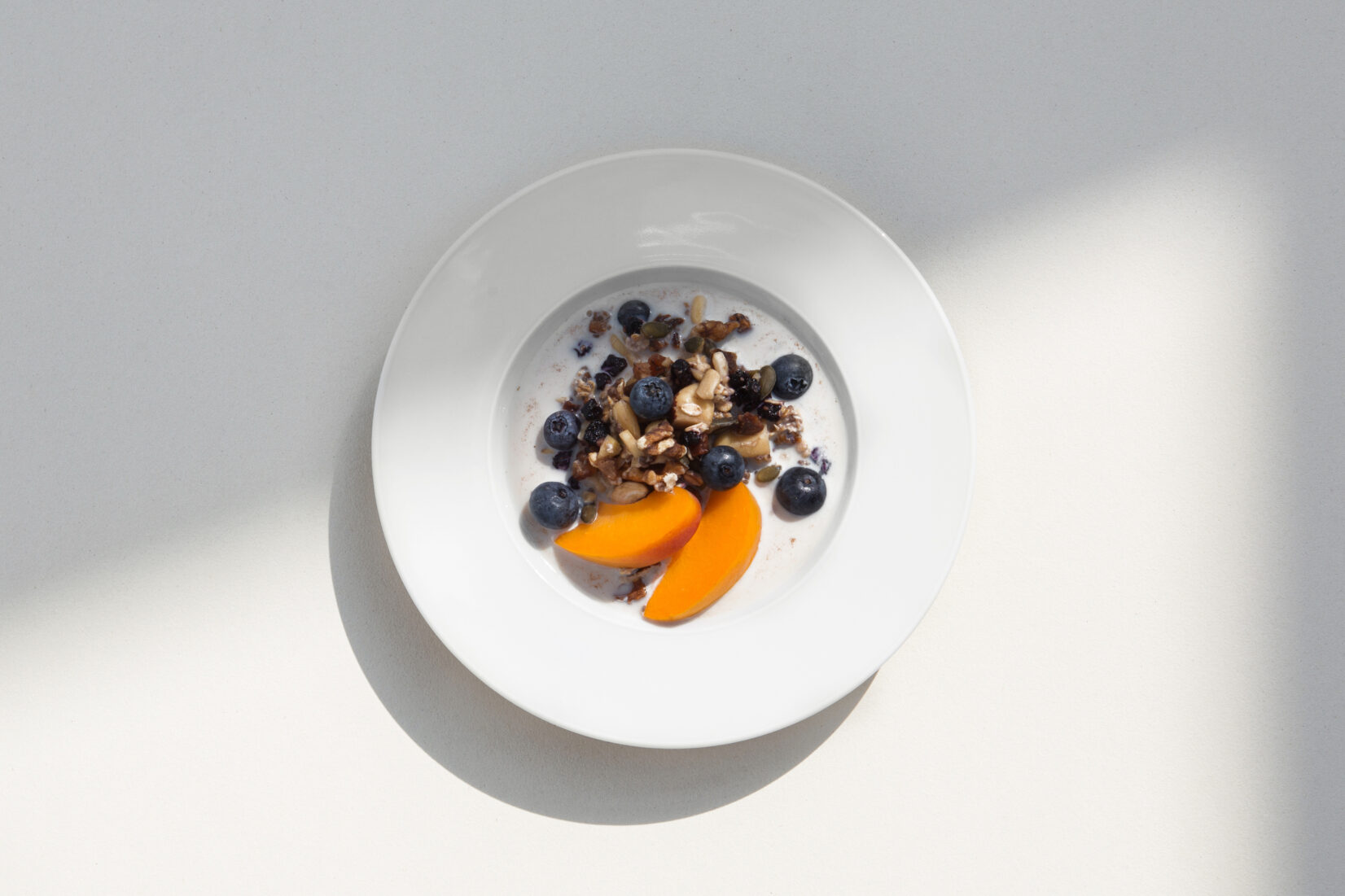breakfast bowl with blue berries and apricot